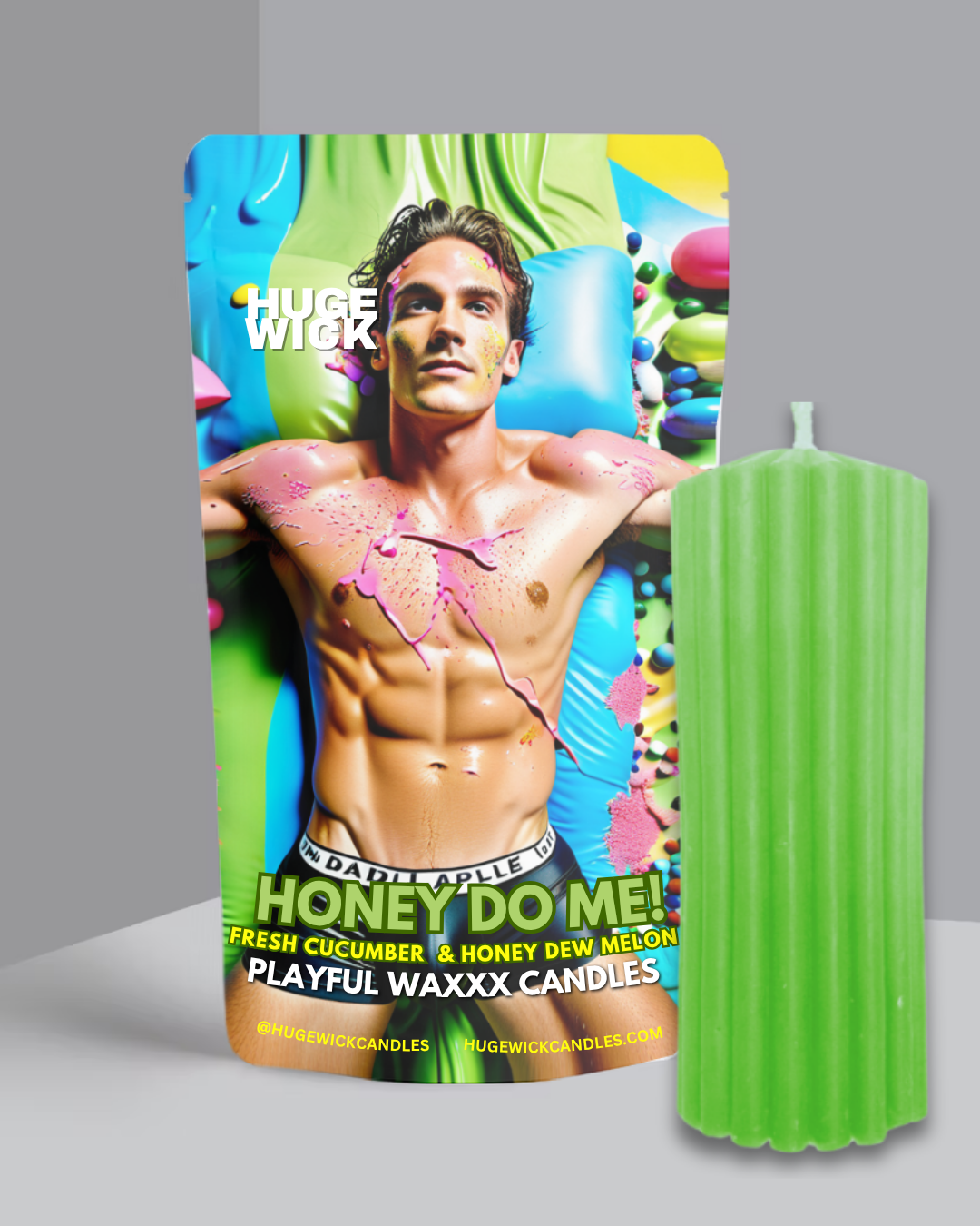 Green Honey Do Me wax play drip candle beside its box