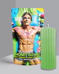 Green Honey Do Me wax play drip candle beside its box