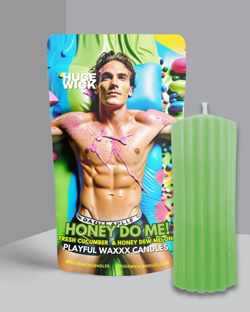 Green Honey Do Me wax play drip candle beside its box